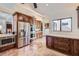 Spacious kitchen features custom wood cabinets, stainless steel appliances, and tiled floors at 9803 N 100Th Pl, Scottsdale, AZ 85258