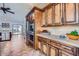 Bright kitchen featuring custom cabinetry, modern appliances, and views to the outdoor living space at 9803 N 100Th Pl, Scottsdale, AZ 85258