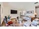 Comfortable living room with vaulted ceiling and a large window at 9803 N 100Th Pl, Scottsdale, AZ 85258