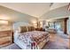 Spacious main bedroom featuring a large closet mirror, and neutral paint colors at 9803 N 100Th Pl, Scottsdale, AZ 85258