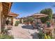 Inviting patio area featuring an umbrella-covered table, chairs, and outdoor seating at 9803 N 100Th Pl, Scottsdale, AZ 85258