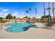 Community swimming pool with plenty of seating for residents with meticulously kept landscaping at 9803 N 100Th Pl, Scottsdale, AZ 85258