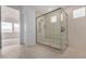 Modern bathroom featuring a glass-enclosed shower with tile surround and a built-in niche at 10308 E Utah Ave, Mesa, AZ 85212
