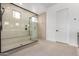 Luxurious bathroom featuring a glass-enclosed shower with modern fixtures at 10308 E Utah Ave, Mesa, AZ 85212
