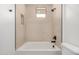 Bright bathroom featuring a white soaking tub and modern fixtures at 10308 E Utah Ave, Mesa, AZ 85212