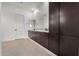 Elegant bathroom featuring a dual sink vanity with dark wood cabinets and under-cabinet lighting at 10308 E Utah Ave, Mesa, AZ 85212
