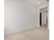 Bright bedroom featuring white walls, tile flooring, and natural light at 10308 E Utah Ave, Mesa, AZ 85212