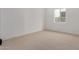 Bedroom featuring carpet floors, white walls, a window and lots of natural light at 10308 E Utah Ave, Mesa, AZ 85212