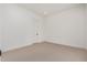 A neutral-toned bedroom with white walls, carpet, and recessed lighting at 10308 E Utah Ave, Mesa, AZ 85212