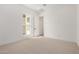 Well-lit bedroom with neutral carpet, white trim and a large window at 10308 E Utah Ave, Mesa, AZ 85212