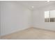 Bedroom featuring white walls, tile floors, a window, and ample natural light at 10308 E Utah Ave, Mesa, AZ 85212