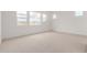 Bright bedroom with large windows at 10308 E Utah Ave, Mesa, AZ 85212