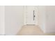 Bright foyer featuring light stone floors and a white door with black hardware at 10308 E Utah Ave, Mesa, AZ 85212