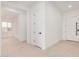 Bright foyer featuring light stone floors, white walls, and modern doors at 10308 E Utah Ave, Mesa, AZ 85212