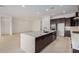 Open floor plan with view of the kitchen and large island with seating at 10308 E Utah Ave, Mesa, AZ 85212
