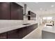 Contemporary kitchen featuring stainless steel appliances and dark cabinets at 10308 E Utah Ave, Mesa, AZ 85212