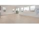 Spacious living area with large windows and sliding glass doors to patio at 10308 E Utah Ave, Mesa, AZ 85212