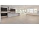 Bright, open-concept kitchen and living room with modern finishes and abundant natural light at 10308 E Utah Ave, Mesa, AZ 85212