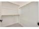 Spacious walk-in closet with neutral carpet, and wood shelves at 10308 E Utah Ave, Mesa, AZ 85212