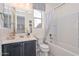 Bathroom featuring a bath tub/shower combination and a single sink vanity with a dark blue cabinet at 10730 W Escuda Dr, Peoria, AZ 85373