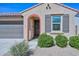 Charming single-story home featuring a tile roof, desert landscaping, covered porch and brick-trim door at 10730 W Escuda Dr, Peoria, AZ 85373