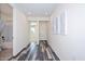 Hallway featuring wood-look floors, recessed lighting, and leads to bathroom and bedroom at 10730 W Escuda Dr, Peoria, AZ 85373