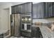 This kitchen features stainless steel appliances and granite countertops at 10730 W Escuda Dr, Peoria, AZ 85373