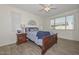 Comfortable main bedroom featuring a bed and hardwood floors, bathed in natural light from the window at 10730 W Escuda Dr, Peoria, AZ 85373