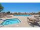 Community pool with a hot tub and lounge chairs overlooking a tranquil lake make for a relaxing atmosphere at 10730 W Escuda Dr, Peoria, AZ 85373