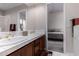 Bathroom vanity featuring dual sinks, and a view into the bedroom at 11664 E Del Timbre Dr, Scottsdale, AZ 85259