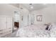 Bedroom featuring neutral walls, vaulted ceiling, and ensuite bathroom at 11664 E Del Timbre Dr, Scottsdale, AZ 85259