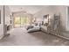 Spacious bedroom features neutral decor, a ceiling fan, and a large window with a view at 11664 E Del Timbre Dr, Scottsdale, AZ 85259