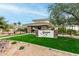 Stonegate community clubhouse with manicured landscaping, water feature, and elegant signage at 11664 E Del Timbre Dr, Scottsdale, AZ 85259