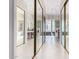 Long hallway showcases the entrances to the bathrooms and mirrored closet doors at 11664 E Del Timbre Dr, Scottsdale, AZ 85259