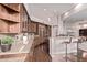 Stylish kitchen with granite countertops, custom cabinets, and a breakfast bar at 11664 E Del Timbre Dr, Scottsdale, AZ 85259
