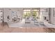 Bright living and dining space with large windows, fireplace and neutral color palette at 11664 E Del Timbre Dr, Scottsdale, AZ 85259
