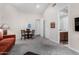 Cozy living area features neutral walls, plush carpeting, and a view into the bathroom at 11664 E Del Timbre Dr, Scottsdale, AZ 85259