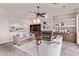 Cozy living room with a fireplace, built-in shelves, and plush seating at 11664 E Del Timbre Dr, Scottsdale, AZ 85259