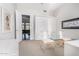 Home office with a built-in Murphy bed and a door to the living room at 11664 E Del Timbre Dr, Scottsdale, AZ 85259
