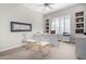 Bright office space with shelving, white walls, a desk, and ample natural light at 11664 E Del Timbre Dr, Scottsdale, AZ 85259