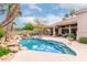 Enjoy the serene pool and spa surrounded by lush desert landscaping and mature trees at 11664 E Del Timbre Dr, Scottsdale, AZ 85259