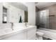 Modern bathroom featuring a double sink vanity with gray shower and tile accents at 12462 N 75Th Ln, Peoria, AZ 85381