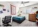 Spacious bedroom featuring bright natural light, neutral carpet, and a comfortable workspace for productivity at 12462 N 75Th Ln, Peoria, AZ 85381