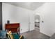 Bright bedroom featuring plush carpeting, a bookshelf, and an open doorway leading to the upstairs landing at 12462 N 75Th Ln, Peoria, AZ 85381