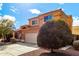 Charming two-story home featuring a well-maintained yard, a spacious driveway, and a classic two-car garage at 12462 N 75Th Ln, Peoria, AZ 85381