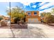 Charming two-story home featuring a well-maintained yard, a spacious driveway, and a classic two-car garage at 12462 N 75Th Ln, Peoria, AZ 85381