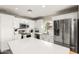 Modern kitchen with white cabinets, stainless steel appliances, and white countertops at 12462 N 75Th Ln, Peoria, AZ 85381