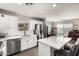 Open-concept kitchen featuring stainless steel appliances, and a large island with bar seating at 12462 N 75Th Ln, Peoria, AZ 85381