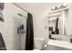 A modern bathroom showcases a tiled shower and sleek vanity sink at 1253 E Avila Ave, Casa Grande, AZ 85122