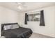 A calm bedroom features a neutral color palette and great natural light at 1253 E Avila Ave, Casa Grande, AZ 85122